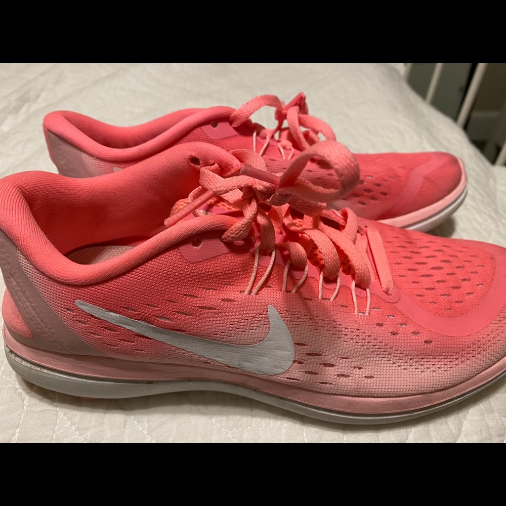 Pink Nike running shoes